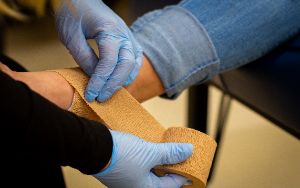  nurse wrapping ankle